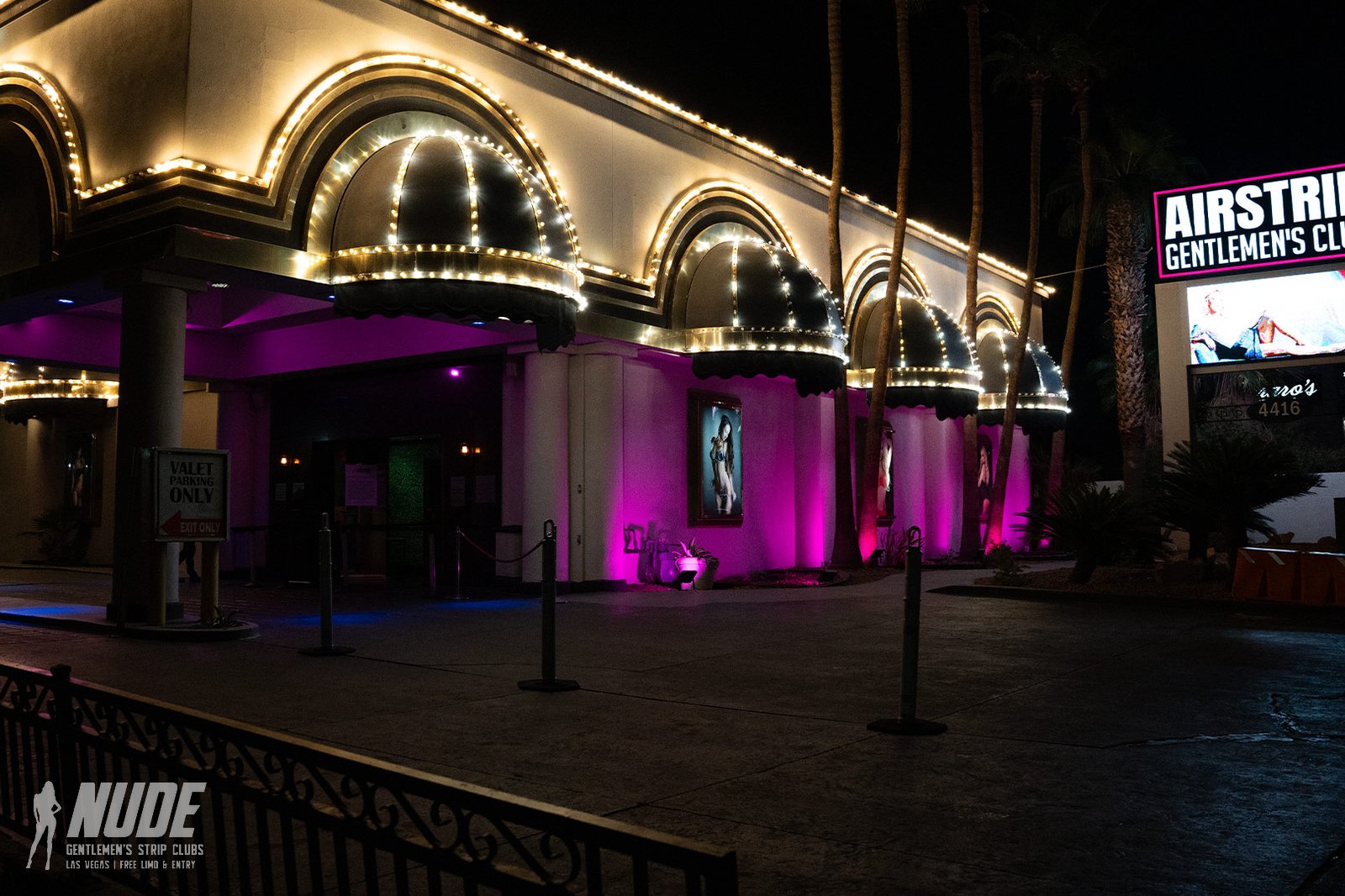 Airstrip Las Vegas facade at night with lit archways