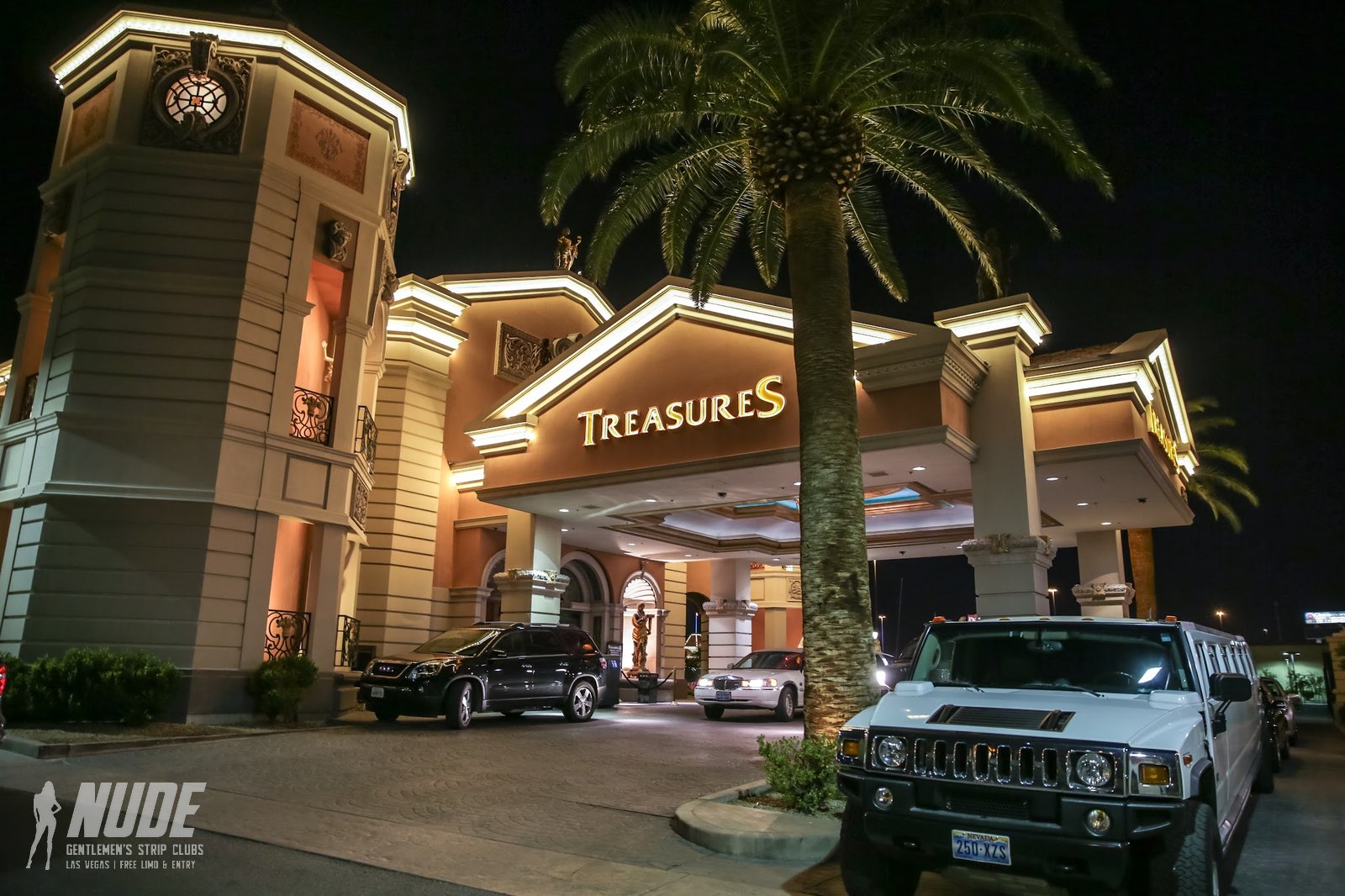 Treasures Las Vegas entrance at night with limousines
