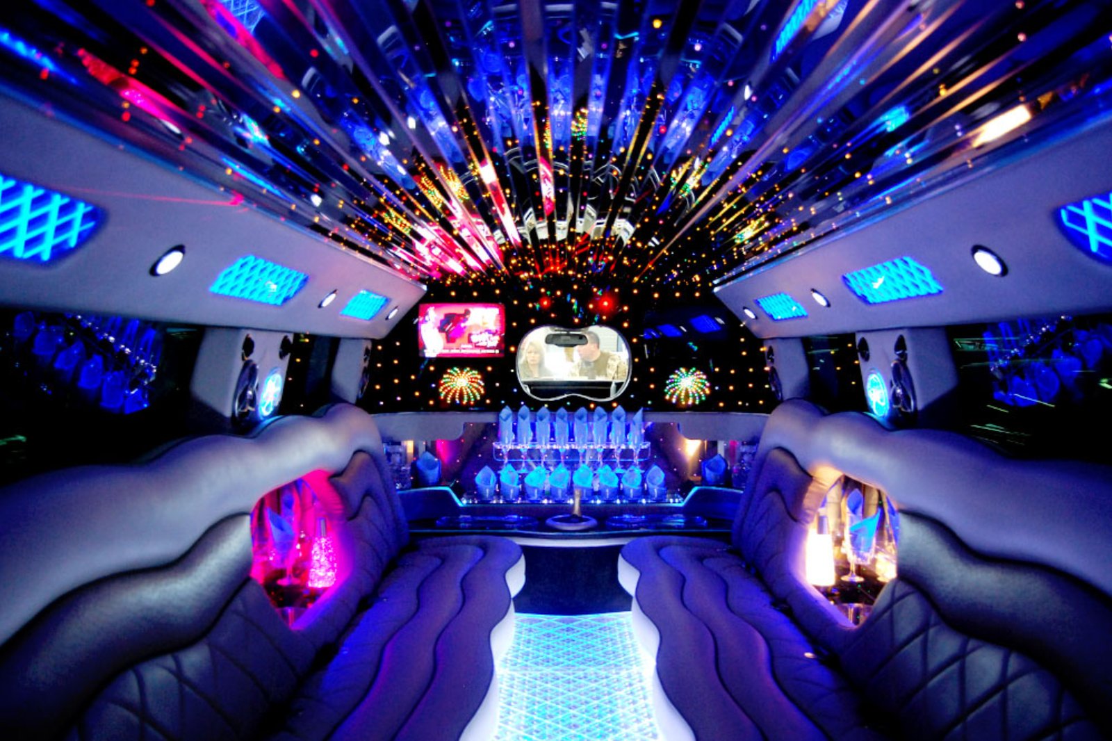 Inside the NUDE Vegas limo with lit ceiling and bar